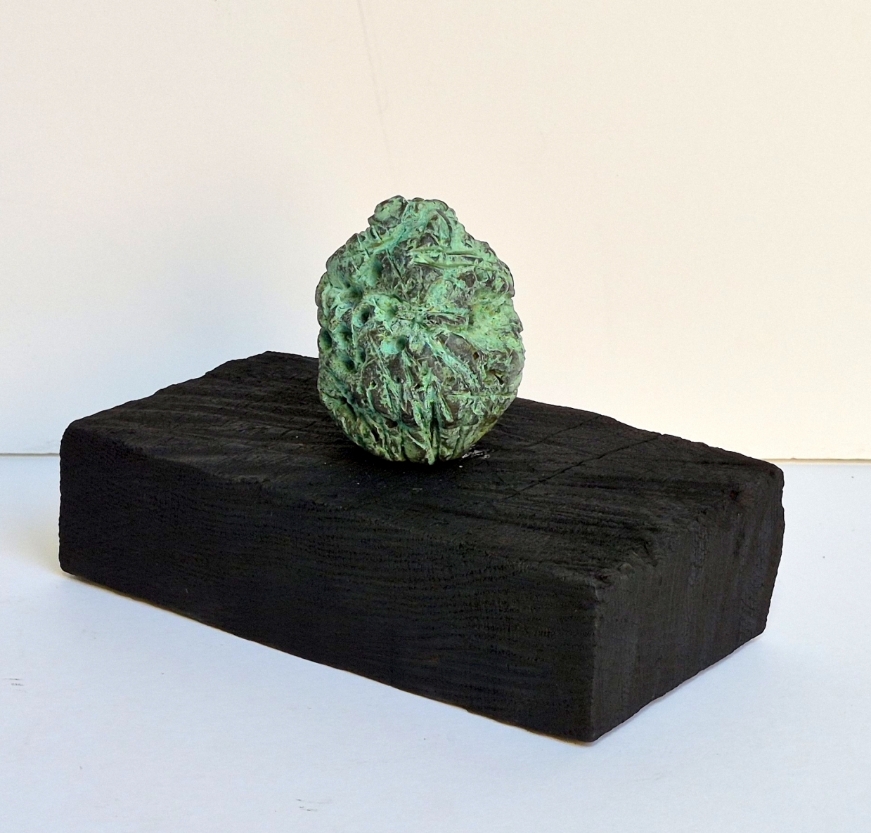 Bud, 2026, bronze, burnt oak, h 13x19.5x10.5 cm, 1/1